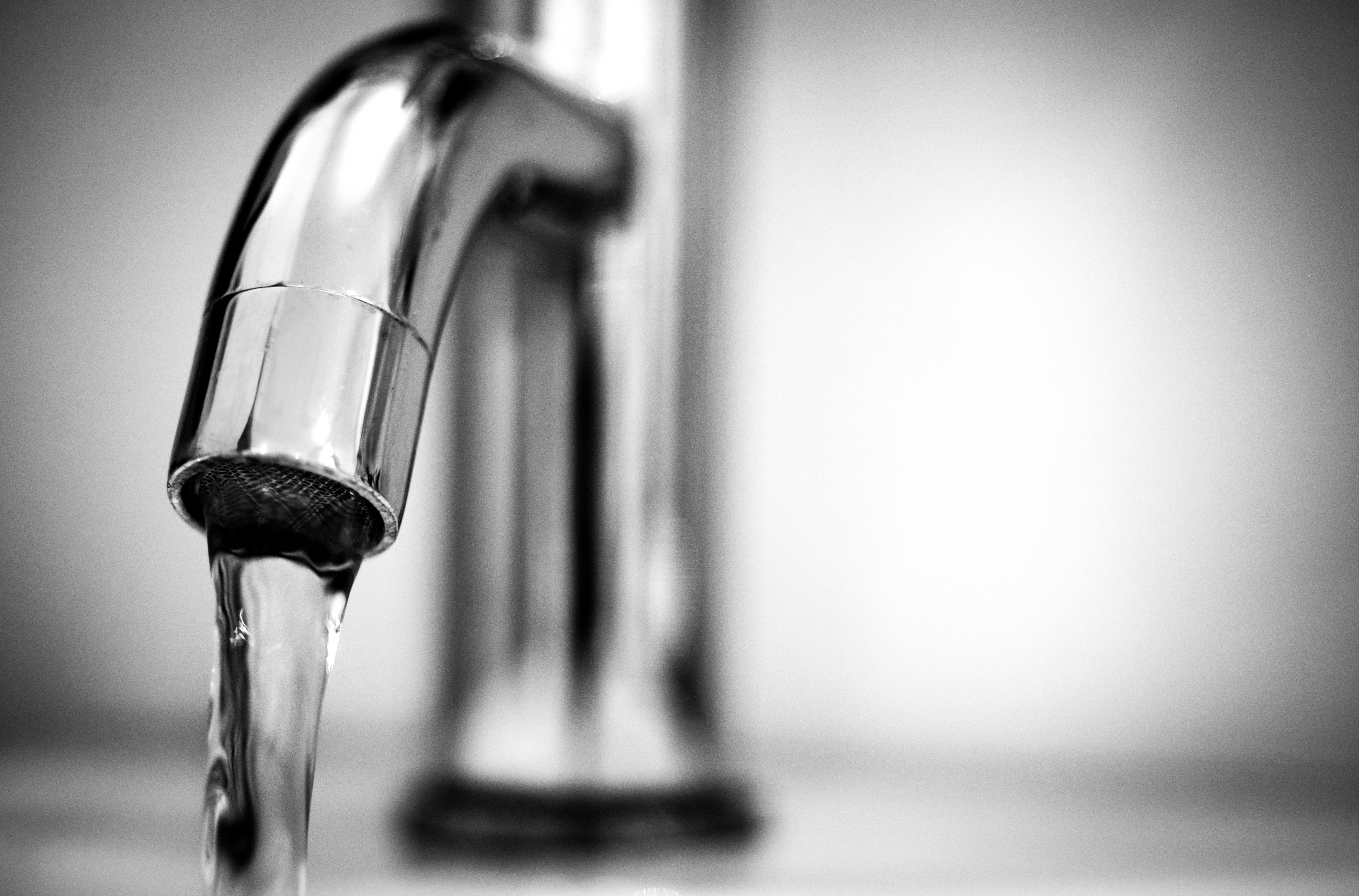 ברז מים - Macro Photography of a Stainless Steel Faucet